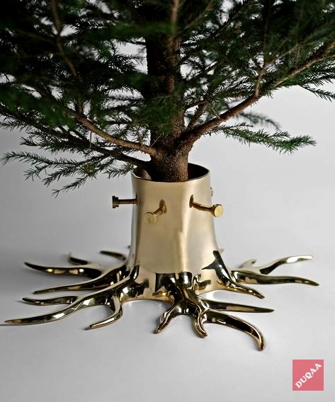 Duqaa’s elegant Christmas tree in a brass stand offers timeless beauty and sturdy support, making it the perfect addition to your holiday decor for a festive and luxurious touch.